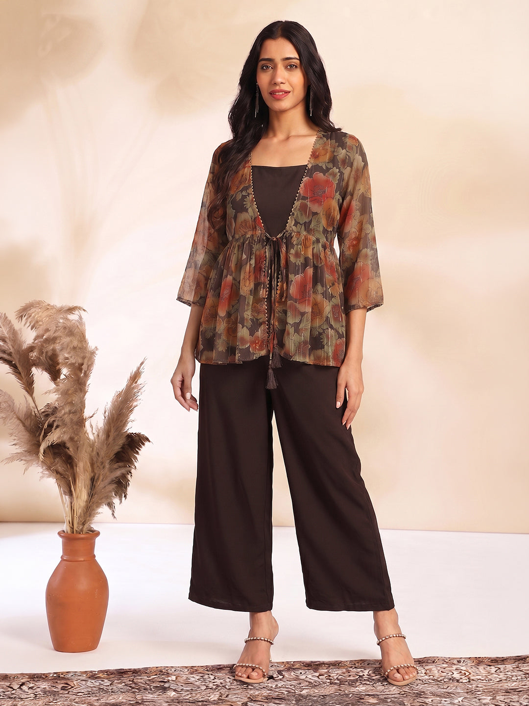 JAA26ST04589_1.jpg Brown Chiffon Solid Shoulder Strap Crop Top with Trouser Floral Printed Shrug - Image 1